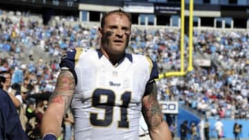 Oct 20, 2013; Charlotte, NC, USA; St. Louis Rams defensive end Chris Long (91) is escorted out after being ejected for fighting during the game at Bank of America Stadium. Mandatory Credit: Sam Sharpe-USA TODAY Sports