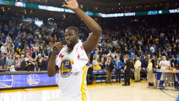 Mar 7, 2016; Oakland, CA, USA; Golden State Warriors forward Draymond Green (23) thanks fan after setting an NBA record 45-game home win streak after a win against the Orlando Magic at Oracle Arena. The Golden State Warriors defeated the Orlando Magic 119-113. Mandatory Credit: Kelley L Cox-USA TODAY Sports