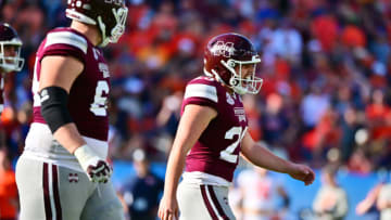 TAMPA, FLORIDA - JANUARY 02: Massimo Biscardi #29 of the Mississippi State Bulldogs reacts after kicking a 27-yard go ahead field goal in the fourth quarter against the Illinois Fighting Illini in the ReliaQuest Bowl at Raymond James Stadium on January 02, 2023 in Tampa, Florida. (Photo by Julio Aguilar/Getty Images)