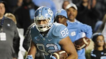 Nov 14, 2015; Chapel Hill, NC, USA; North Carolina Tar Heels tight end Brandon Fritts (82) runs after a catch against the Miami Hurricanes during the second half at Kenan Memorial Stadium. The Tar Heels won 59 - 21. Mandatory Credit: Evan Pike-USA TODAY Sports