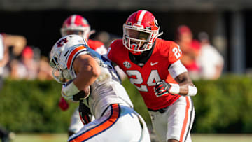 Auburn footballOct 8, 2022; Athens, Georgia, USA; Auburn Tigers tight end John Samuel Shenker (25) is tackled by Georgia Bulldogs defensive back Malaki Starks (24) during the first half at Sanford Stadium. Mandatory Credit: Dale Zanine-USA TODAY Sports