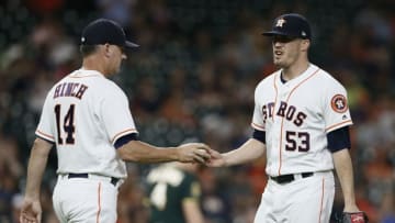HOUSTON, TX - JULY 10: Manager AJ Hinch #14 of the Houston Astros takes the ball from Ken Giles #53 (Photo by Bob Levey/Getty Images)