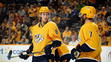 NASHVILLE, TN - DECEMBER 13: Kyle Turris #8 talks with Yannick Weber #7 of the Nashville Predators prior to a face-off against the Vancouver Canucks at Bridgestone Arena on December 13, 2018 in Nashville, Tennessee. (Photo by John Russell/NHLI via Getty Images)
