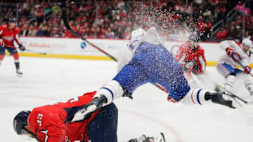 WASHINGTON, DC - NOVEMBER 15: Artturi Lehkonen #62 of the Montreal Canadiens collides with Radko Gudas #33 of the Washington Capitals in the second period at Capital One Arena on November 15, 2019 in Washington, DC. (Photo by Patrick McDermott/NHLI via Getty Images)