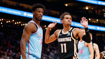 ATLANTA, GA - FEBRUARY 20: Trae Young #11 of the Atlanta Hawks reacts alongside Jimmy Butler #22 of the Miami Heat during the second half of an NBA game at State Farm Arena on February 20, 2020 in Atlanta, Georgia. NOTE TO USER: User expressly acknowledges and agrees that, by downloading and/or using this photograph, user is consenting to the terms and conditions of the Getty Images License Agreement. (Photo by Todd Kirkland/Getty Images)