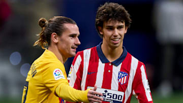 Joao Felix of Atletico de Madrid jocking with Antoine Griezmann of FC Barcelona. (Photo by Diego Souto/Quality Sport Images/Getty Images)