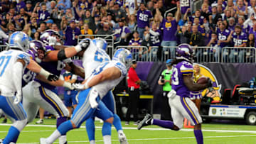 MINNEAPOLIS, MN - OCTOBER 1: Dalvin Cook #33 of the Minnesota Vikings scores a rushing touchdown in the second quarter of the game agains the Detroit Lions on October 1, 2017 at U.S. Bank Stadium in Minneapolis, Minnesota. (Photo by Adam Bettcher/Getty Images)