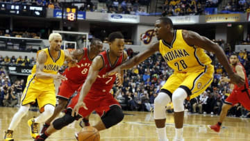 Dec 14, 2015; Indianapolis, IN, USA; Toronto Raptors guard Kyle Lowry (7) drives to the basket against Indiana Pacers center Ian Mahinmi (28) at Bankers Life Fieldhouse. Indiana defeats Toronto 106-90. Mandatory Credit: Brian Spurlock-USA TODAY Sports