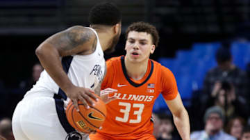 Feb 14, 2023; University Park, Pennsylvania, USA; Illinois Fighting Illini forward Coleman Hawkins (33) defends as Penn State Nittany Lions guard/forward Myles Dread (2) holds the ball during the second half at Bryce Jordan Center. Penn State defeated Illinois 93-81. Mandatory Credit: Matthew OHaren-USA TODAY Sports