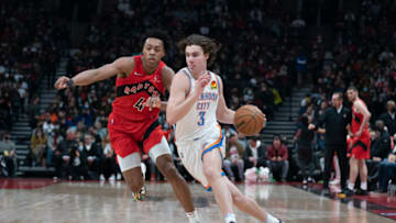 OKC Thunder guard Josh Giddey (3) dribbles the ball as Toronto Raptors forward Scottie Barnes (4) defends: Nick Turchiaro-USA TODAY Sports