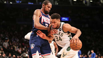 Jan 7, 2022; Brooklyn, New York, USA; Milwaukee Bucks forward Giannis Antetokounmpo (34) drives past Brooklyn Nets forward Kevin Durant (7) in the first quarter at Barclays Center. Mandatory Credit: Wendell Cruz-USA TODAY Sports