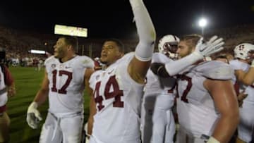 Sep 19, 2015; Los Angeles, CA, USA; Stanford Cardinal defensive end Brennan Scarlett (17) and linebacker Kevin Palma (44) celebrate after the game against the Southern California Trojans at Los Angeles Memorial Coliseum. Stanford defeated USC 41-31. Mandatory Credit: Kirby Lee-USA TODAY Sports