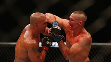 LAS VEGAS, NV - JULY 11: (R-L) Rory MacDonald elbows Robbie Lawler in their UFC welterweight title fight during the UFC 189 event inside MGM Grand Garden Arena on July 11, 2015 in Las Vegas, Nevada. (Photo by Christian Petersen/Zuffa LLC/Zuffa LLC via Getty Images)