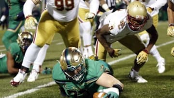 Nov 21, 2015; Boston, MA, USA; Notre Dame Fighting Irish center Nick Martin (72) recovers a fumble during the first quarter against the Boston College Eagles at Fenway Park. Mandatory Credit: Greg M. Cooper-USA TODAY Sports