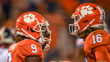 Oct 3, 2020; Clemson, SC, USA; Clemson running back Travis Etienne (9) is congratulated by quarterback Trevor Lawrence (16) after he scored during the third quarter of the game on Saturday, October 3, 2020 at Memorial Stadium in Clemson, S.C. Mandatory Credit: Ken Ruinard-USA TODAY NETWORK