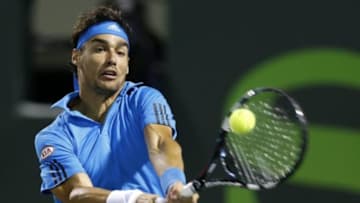 Mar 25, 2014; Miami, FL, USA; Fabio Fognini hits a backhand against Rafael Nadal (not pictured) on day nine of the Sony Open at Crandon Tennis Center. Nadal won 6-2, 6-2. Mandatory Credit: Geoff Burke-USA TODAY Sports