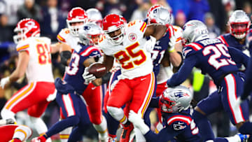 FOXBOROUGH, MASSACHUSETTS - DECEMBER 08: LeSean McCoy #25 of the Kansas City Chiefs runs with the ball as Dont'a Hightower #54 of the New England Patriots attempts to tackle him during the first half in the game at Gillette Stadium on December 08, 2019 in Foxborough, Massachusetts. (Photo by Adam Glanzman/Getty Images)