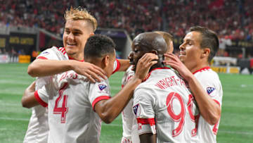ATLANTA, GA MAY 20: New York's Bradley Wright-Phillips (99) is surrounded by teammates after scoring a goal during the match between Atlanta United and New York Red Bulls on May 20, 2018 at Mercedes-Benz Stadium in Atlanta, GA. The New York Red Bulls defeated Atlanta United FC 3 1. (Photo by Rich von Biberstein/Icon Sportswire via Getty Images)