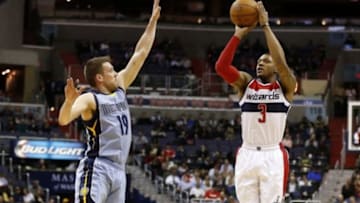 Mar 12, 2015; Washington, DC, USA; Washington Wizards guard Bradley Beal (3) shoots the ball as Memphis Grizzlies guard Beno Udrih (19) defends in the first quarter at Verizon Center. Mandatory Credit: Geoff Burke-USA TODAY Sports