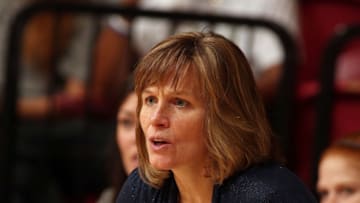 LOS ANGELES, CA - NOVEMBER 21: Head coach Faith Mimnaugh of the Cal Poly Mustangs eyes the play from the bench against the Loyola Marymount Lions in the first half of the home opening game at Gersten Pavilion on November 21, 2014 in Los Angeles, California. Cal Poly won 87-79. (Photo by Jeff Golden/Getty Images)