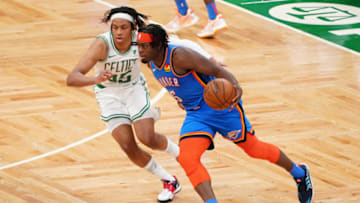 OKC Thunder forward Lu Dort (5) moves the ball against Boston Celtics guard Romeo Langford (45) in the fourth quarter at TD Garden. Mandatory Credit: David Butler II-USA TODAY Sports.
