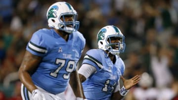 NEW ORLEANS, LA - SEPTEMBER 24: Glen Cuiellette #14 of the Tulane Green Wave celebrates after throwing for a touchdown during the second half of a game against the Louisiana-Lafayette Ragin Cajuns at Yulman Stadium on September 24, 2016 in New Orleans, Louisiana. (Photo by Jonathan Bachman/Getty Images)