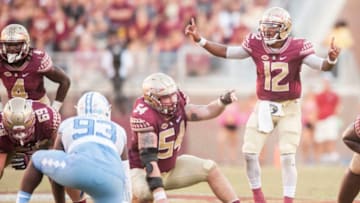 TALLAHASSEE, FL - OCTOBER 01: Deondre Francois #12 and Alec Eberle #54 of the Florida State Seminoles make calls on the line during the game against the North Carolina Tar Heels at Doak Campbell Stadium on October 1, 2016 in Tallahassee, Florida. (Photo by Jeff Gammons/Getty Images)