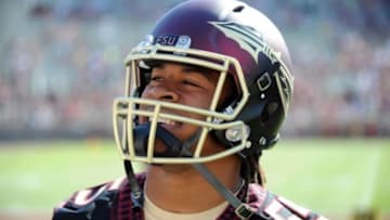 Apr 12, 2014; Tallahassee, FL, USA; Florida State Seminoles former running back Devonta Freeman (8) smiles as he models the new uniforms during the spring game at Doak Campbell Stadium. Mandatory Credit: Melina Vastola-USA TODAY Sports