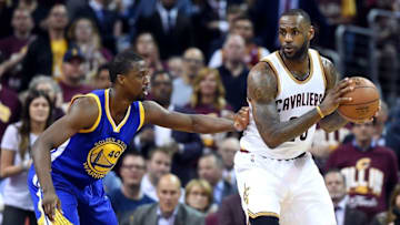 Jun 8, 2016; Cleveland, OH, USA; Cleveland Cavaliers forward LeBron James (23) handles the ball against Golden State Warriors forward Harrison Barnes (40) during the second quarter in game three of the NBA Finals at Quicken Loans Arena. Mandatory Credit: Ken Blaze-USA TODAY Sports