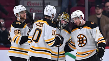 MONTREAL, QC - NOVEMBER 26: Goaltender Jaroslav Halak #41 of the Boston Bruins celebrates a victory with teammates David Pastrnak #88, Anders Bjork #10 and Matt Grzelcyk #48 against the Montreal Canadiens at the Bell Centre on November 26, 2019 in Montreal, Canada. The Boston Bruins defeated the Montreal Canadiens 8-1. (Photo by Minas Panagiotakis/Getty Images)
