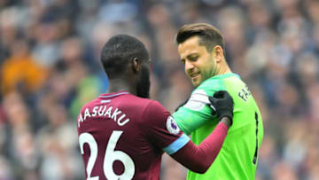 LONDON, ENGLAND - APRIL 27: Arthur Masuaku of West Ham United puts a captain's armband on teammate Lukasz Fabianski during the Premier League match between Tottenham Hotspur and West Ham United at Tottenham Hotspur Stadium on April 27, 2019 in London, United Kingdom. (Photo by Michael Regan/Getty Images)