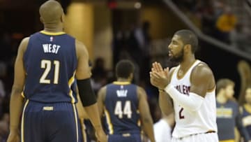 Nov 29, 2014; Cleveland, OH, USA; Cleveland Cavaliers guard Kyrie Irving (2) reacts beside Indiana Pacers forward David West (21)during a timeout in the fourth quarter at Quicken Loans Arena. Mandatory Credit: David Richard-USA TODAY Sports