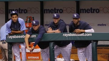 Aug 16, 2013; St. Petersburg, FL, USA; Tampa Bay Rays pitcher Chris Archer (22), pitcher Matt Moore (55), pitcher Alex Cobb (53) and pitcher David Price (14) watch from the dugout during the second inning against the Toronto Blue Jays at Tropicana Field. Mandatory Credit: Kim Klement-USA TODAY Sports