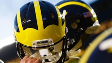 October 20, 2012; Ann Arbor, MI, USA; Michigan Wolverines players hold up their helmets after the game against the Michigan State Spartans at Michigan Stadium. Mandatory Credit: Rick Osentoski-USA TODAY Sports
