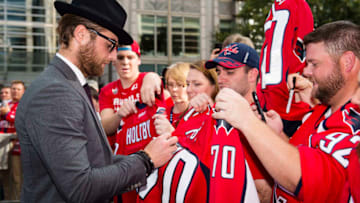 WASHINGTON, DC - OCTOBER 07: Braden Holtby #70 of the Washington Capitals signs autographs for fans on the Rock the Red Carpet prior to the start of a game against the Montreal Canadiens at Capital One Arena on October 7, 2017 in Washington, DC. (Photo by Patrick McDermott/NHLI via Getty Images)