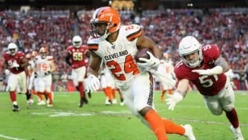 GLENDALE, ARIZONA - DECEMBER 15: Running back Nick Chubb #24 of the Cleveland Browns runs with the football past linebacker Tanner Vallejo #51 of the Arizona Cardinals during the second half of the NFL game at State Farm Stadium on December 15, 2019 in Glendale, Arizona. The Cardinals defeated the Browns 38-24. (Photo by Christian Petersen/Getty Images)