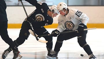 BOSTON - JUNE 28: Oskar Steen, right, and John Beecher fight for the puck during a faceoff as part of a scrimmage on Day 3 of a Boston Bruins development camp at Warrior Ice Arena in the Brighton neighborhood of Boston on June 28, 2019. (Photo by John Tlumacki/The Boston Globe via Getty Images)