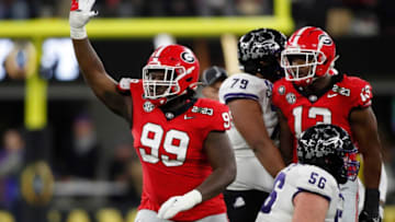 Georgia defensive lineman Bear Alexander (99) waves goodbye to the TCU fans after sacking TCU quarterback Max Duggan (15) during the second half of the NCAA College Football National Championship game between TCU and Georgia on Monday, Jan. 9, 2023, in Inglewood, Calif.News Joshua L Jones