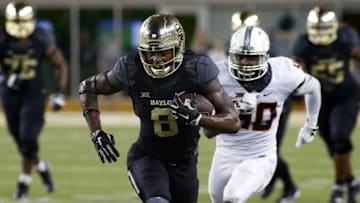 Sep 24, 2016; Waco, TX, USA; Baylor Bears wide receiver Ishmael Zamora (8) runs after the catch by Oklahoma State Cowboys linebacker Devante Averette (40) during the second half at McLane Stadium. Baylor won 35-24. Mandatory Credit: Ray Carlin-USA TODAY Sports