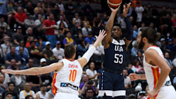 ANAHEIM, CALIFORNIA - AUGUST 16: Donovan Mitchell #53 of the United States shoots a jumper between Victor Claver #10 and Ricky Rubio #9 of Spain in the first half during an exhibition game at Honda Center on August 16, 2019 in Anaheim, California. (Photo by Harry How/Getty Images)