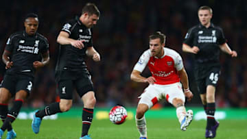 LONDON, ENGLAND - AUGUST 24: James Milner of Liverpool is closed down by Aaron Ramsey of Arsenal during the Barclays Premier League match between Arsenal and Liverpool at Emirates Stadium on August 24, 2015 in London, England. (Photo by Clive Mason/Getty Images)