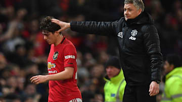Manchester United's Norwegian manager Ole Gunnar Solskjaer (R) consoles Manchester United's Welsh midfielder Daniel James as he is substituted off the pitch during the English League Cup semi-final first leg football match between Manchester United and Manchester City at Old Trafford in Manchester, north west England on January 7, 2020. (Photo by Paul ELLIS / AFP) / RESTRICTED TO EDITORIAL USE. No use with unauthorized audio, video, data, fixture lists, club/league logos or 'live' services. Online in-match use limited to 75 images, no video emulation. No use in betting, games or single club/league/player publications. / (Photo by PAUL ELLIS/AFP via Getty Images)