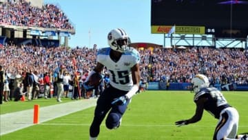 Sep 22, 2013; Nashville, TN, USA; Tennessee Titans wide receiver Justin Hunter (15) scores the winning touchdown against San Diego Chargers cornerback Crezdon Butler (20) during the second half at LP Field. The Titans beat the Chargers 20-17. Mandatory Credit: Don McPeak-USA TODAY Sports