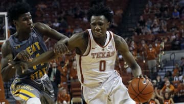 AUSTIN, TX - DECEMBER 27: Tevin Mack #0 of the Texas Longhorns drives around Alonzo Walker #14 of the Kent State Golden Flashes at the Frank Erwin Center on December 27, 2016 in Austin, Texas. (Photo by Chris Covatta/Getty Images)