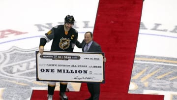 Jan 31, 2016; Nashville, TN, USA; Pacific Division forward John Scott (28) of the Montreal Canadiens stands with NHL Commissioner Gary Bettman after the 2016 NHL All Star Game at Bridgestone Arena. Mandatory Credit: Aaron Doster-USA TODAY Sports