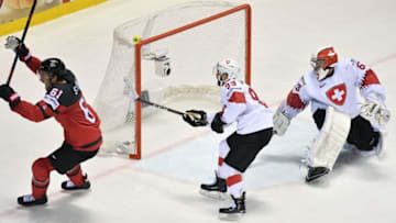 Canada's forward Mark Stone scores the winning goal past Switzerland's goalkeeper Leonardo Genoni during the IIHF Men's Ice Hockey World Championships quarter-final match between Canada and Switzerland on May 23, 2019 at the Steel Arena in Kosice, Slovakia. (Photo by JOE KLAMAR / AFP) (Photo credit should read JOE KLAMAR/AFP/Getty Images)