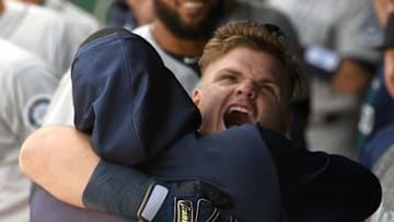 KANSAS CITY, MO - APRIL 11: Seattle Mariners designated hitter Daniel Vogelbach (20) gets a bear hug in the dugout after hitting a game-winning home run in the tenth inning during a Major League Baseball game between the Seattle Mariners and the Kansas City Royals on April 11, 2019, at Kaufmann Stadium, Kansas City, Mo. (Photo by Keith Gillett/Icon Sportswire via Getty Images)