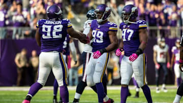 Oct 9, 2016; Minneapolis, MN, USA; Minnesota Vikings defensive end Danielle Hunter (99) celebrates with defensive end Everson Griffen (97) and defensive tackle Tom Johnson (92) during the fourth quarter against the Houston Texans at U.S. Bank Stadium. The Vikings defeated the Texans 31-13. Mandatory Credit: Brace Hemmelgarn-USA TODAY Sports