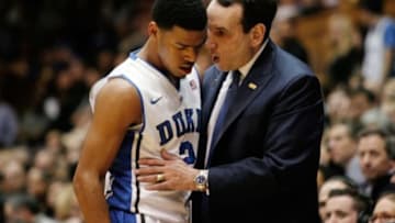 Feb 4, 2014; Durham, NC, USA; Duke Blue Devils head coach Mike Krzyzewski talks to guard Quinn Cook (2) as he heads to the bench in their game against the Wake Forest Demon Deaconsat Cameron Indoor Stadium. Mandatory Credit: Mark Dolejs-USA TODAY Sports