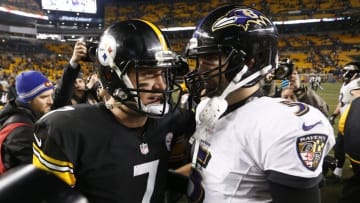 Jan 3, 2015; Pittsburgh, PA, USA; Pittsburgh Steelers quarterback Ben Roethlisberger (7) talks to Baltimore Ravens quarterback Joe Flacco (5) after their 2014 AFC Wild Card playoff football game at Heinz Field. The Ravens won 30-17. Mandatory Credit: Charles LeClaire-USA TODAY Sports